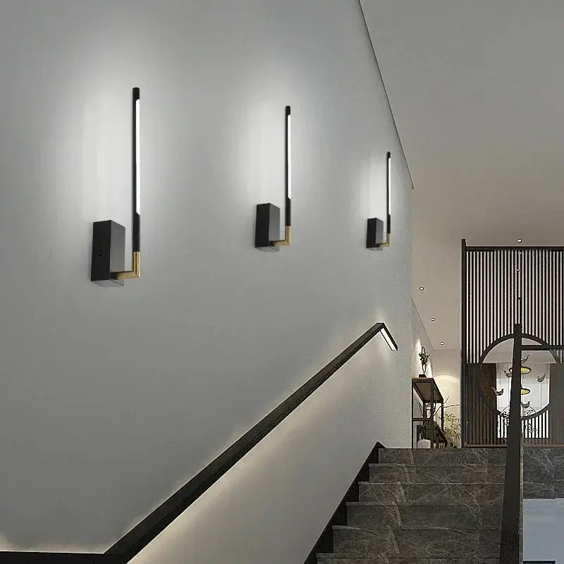 DecorBites Linen Ceiling Chandelier black gold pendant lamps along gray stairwell wall on Tampa Home & Garden Store