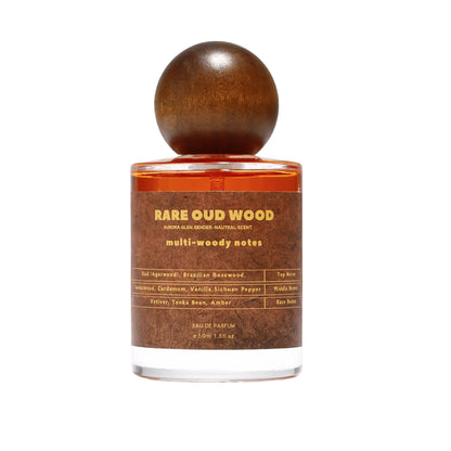 Rare Oud Wood perfume bottle with a round wooden cap and orange glass, multi-woody notes on Tampa Home & Garden Store