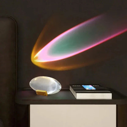 Eye Of The Sky LED crystal table lamp with oval clear body and gold base on a nightstand on Tampa Home & Garden Store