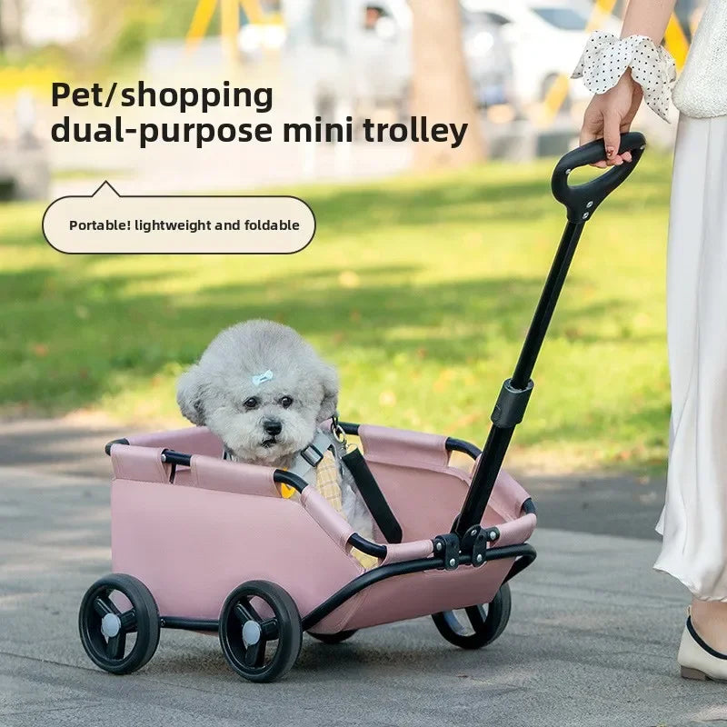 Pet Zen pink 4-wheel dog stroller with sunshade, small dog inside, outdoor stroll on Tampa Home & Garden Store