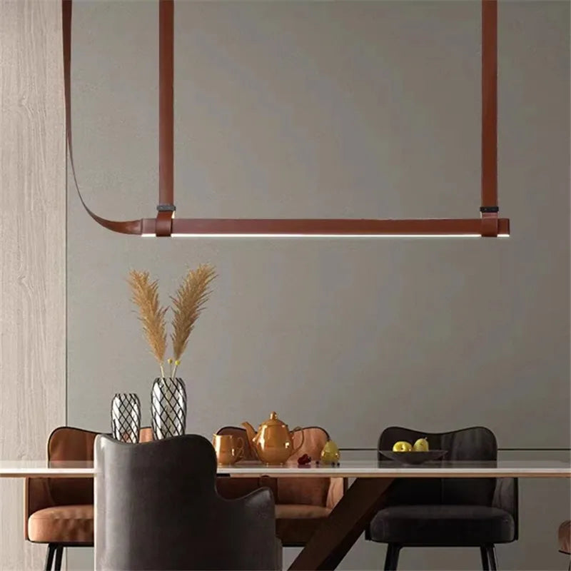 DecorBites LED Art Deco chandelier in copper-brown metal, suspended over dining table on Tampa Home & Garden Store