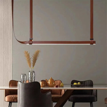 DecorBites LED Art Deco chandelier in copper-brown metal, suspended over dining table on Tampa Home & Garden Store
