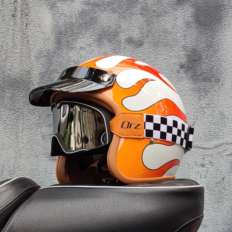 Retro motorcycle helmet by BikerZoneZ in orange with white flame graphics, mirrored visor, checkered strap on Tampa Home & Garden Store