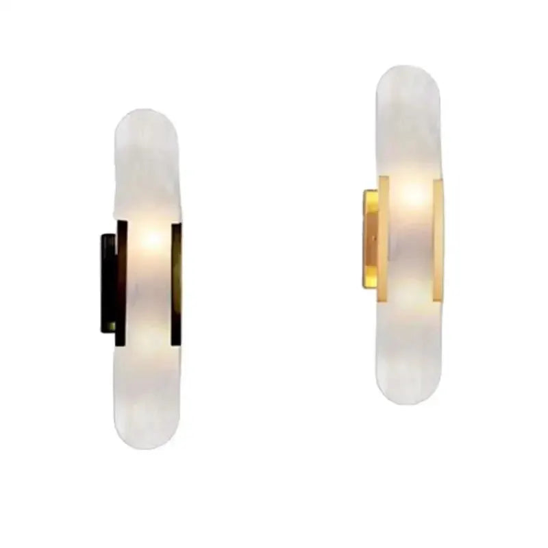 DecorBites alabaster wall sconces pair with gold metal brackets, warm ambient light on Tampa Home & Garden Store