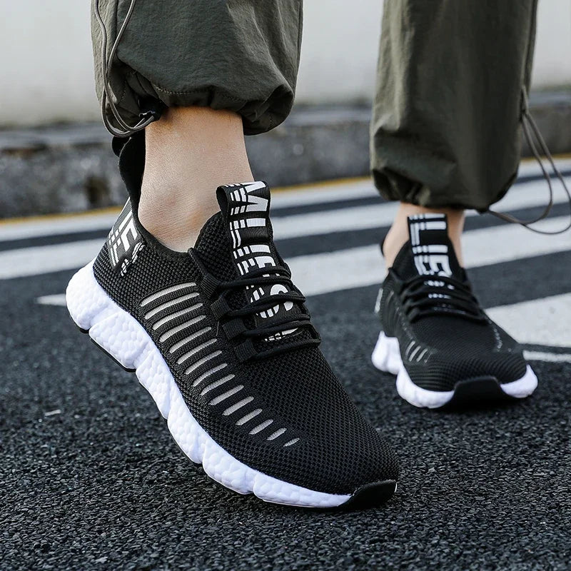 Training sneakers EstaliosFit, black breathable mesh athletic shoes with white sole, pair on Tampa Home & Garden Store