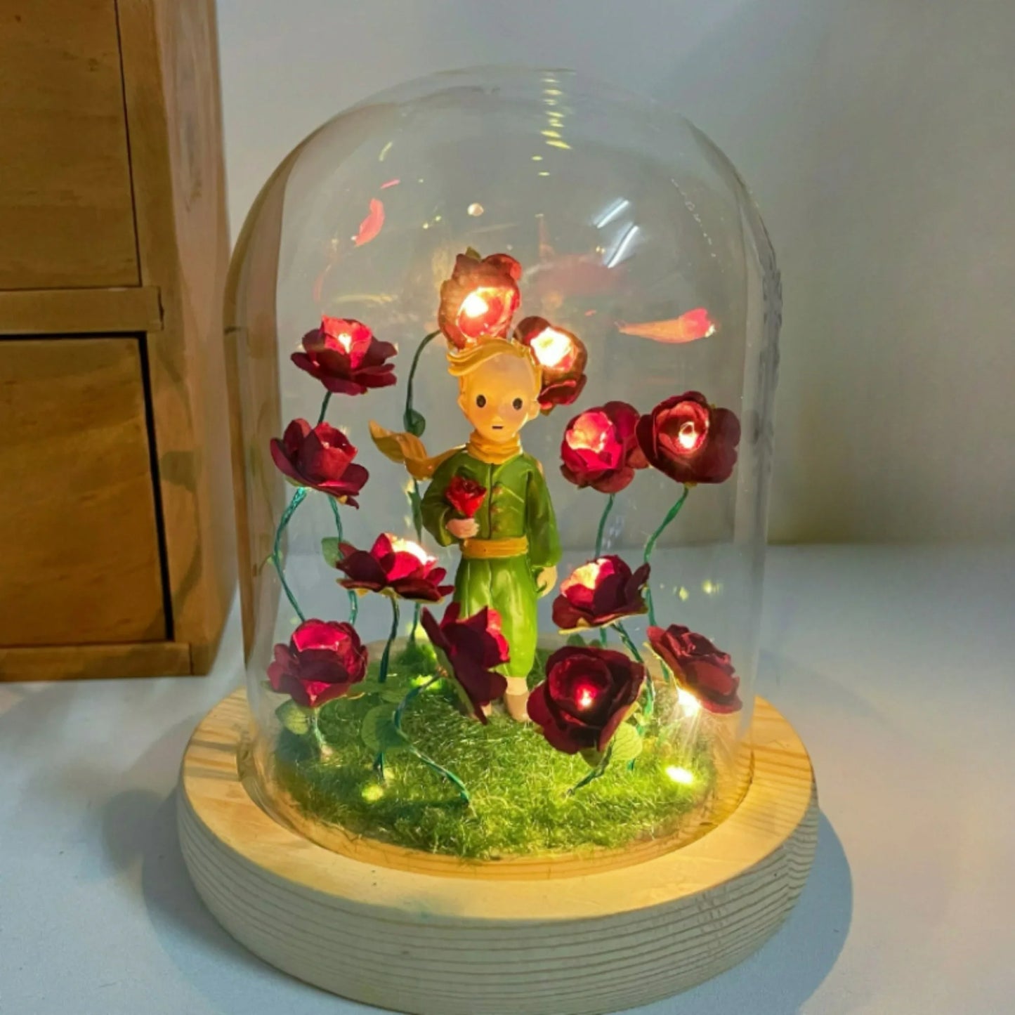 Little Prince Night Light in a glass dome with red immortal roses around a yellow figure on a wooden base on Tampa Home & Garden Store