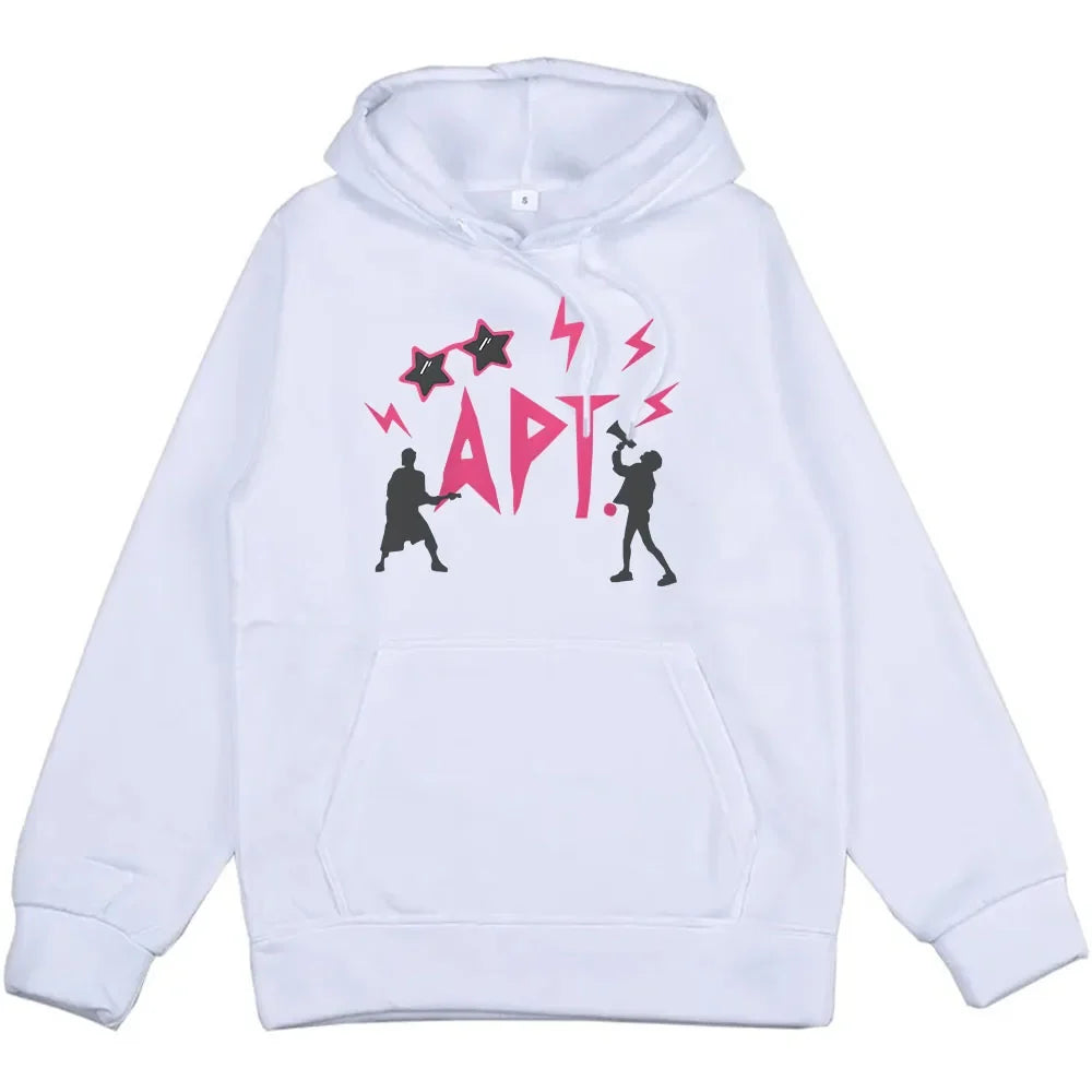 White unisex hoodie with pink APT graphic, accents, and silhouette figures in streetwear style on Tampa Home & Garden Store