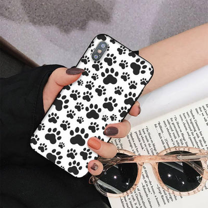 Dog paw phone case Stevvex for iPhone with white background and black paw prints on Tampa Home & Garden Store