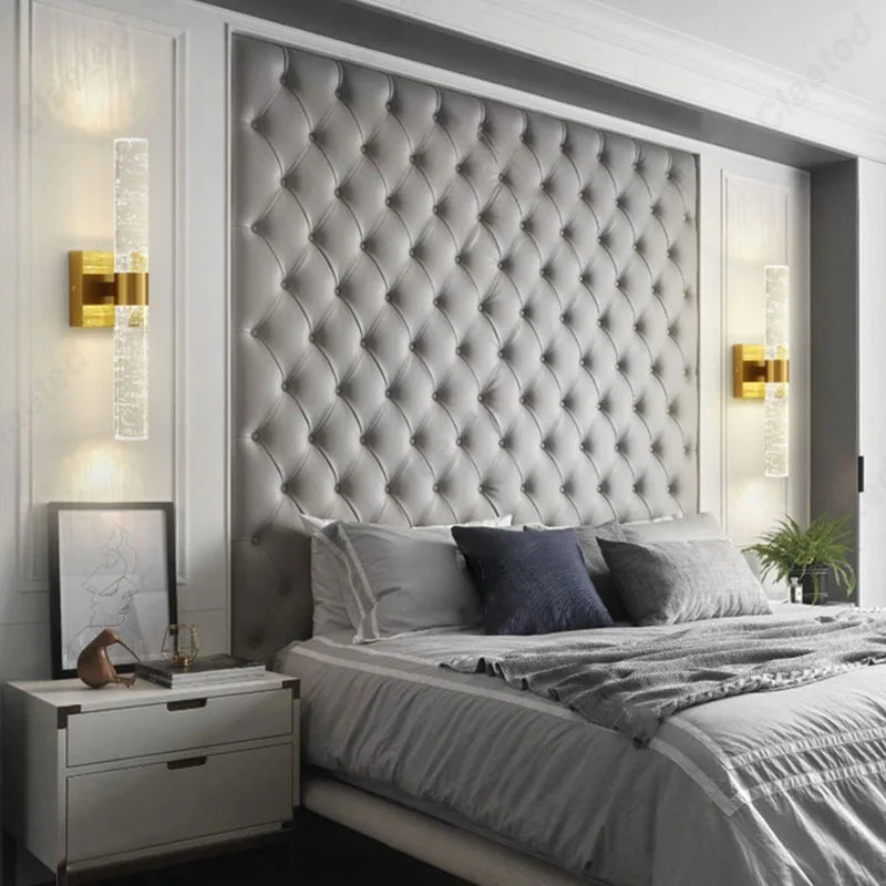 New LED Wrought Iron Crystal Wall Lamp by Perfecsy, gold finish with vertical crystal bars, pair flanking a tufted headboard on Tampa Home & Garden Store