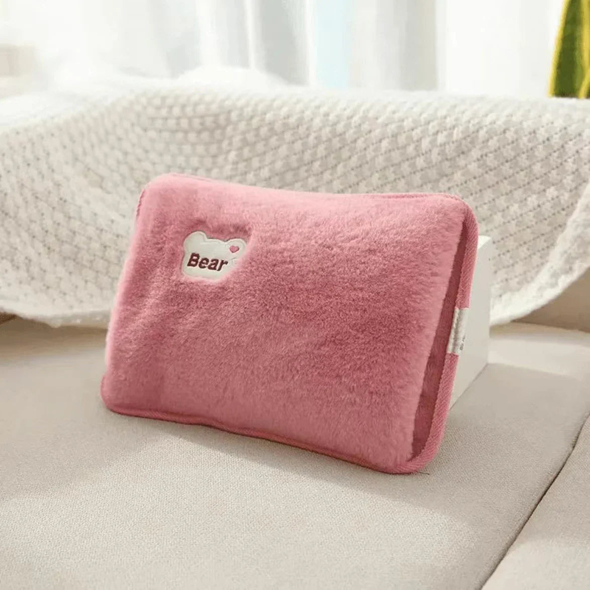 Pink plush rechargeable hand warmer with bear patch, soft velvet fabric on Tampa Home & Garden Store