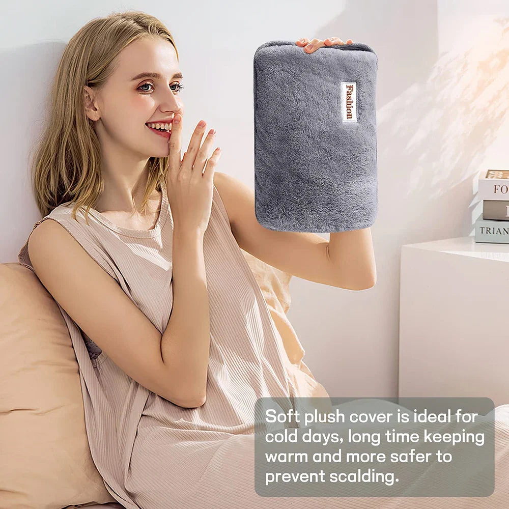 Rechargeable hand warmer with soft gray plush cover by Silcy Skin held by a smiling woman on Tampa Home & Garden Store