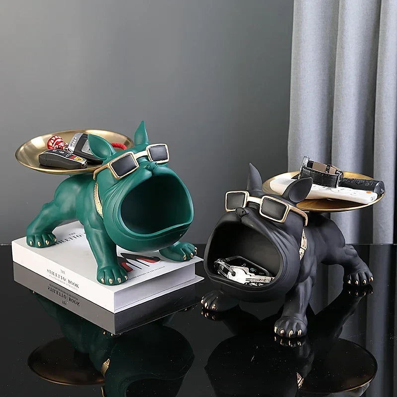 Two bulldog key storage figurines in green and black resin with sunglasses and tray tops on Tampa Home & Garden Store