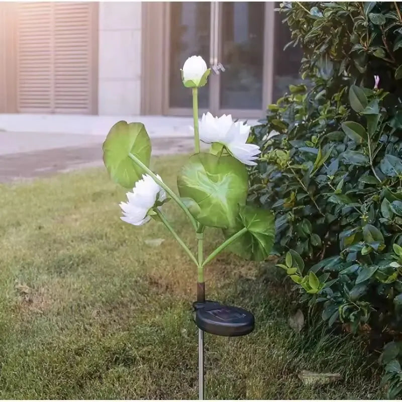 Solar LED 3-Head Lotus Garden Light on stake with white lotus blooms and leaves for outdoors on Tampa Home & Garden Store