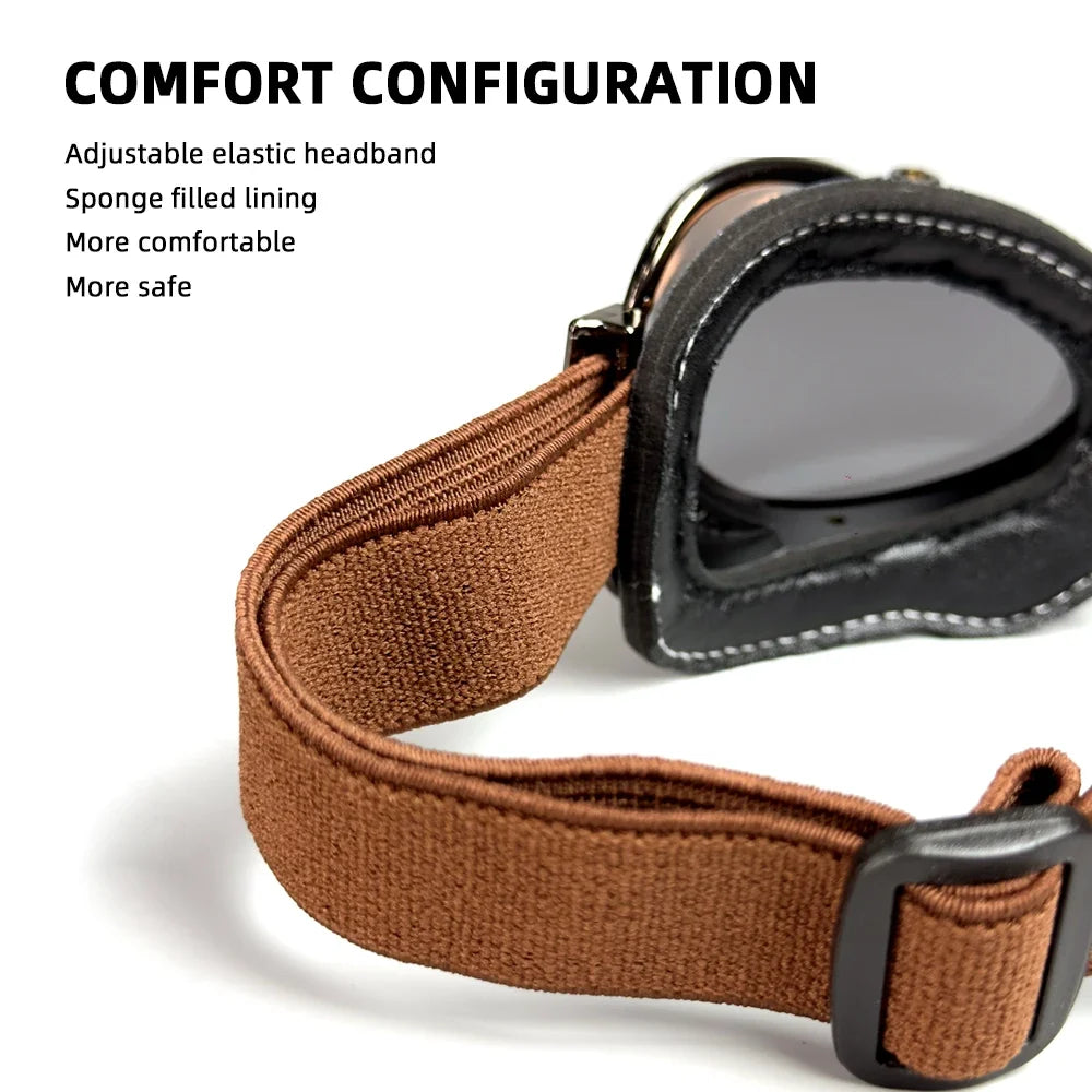 Motorcycle vintage goggles with brown elastic strap and black frame on Tampa Home & Garden Store