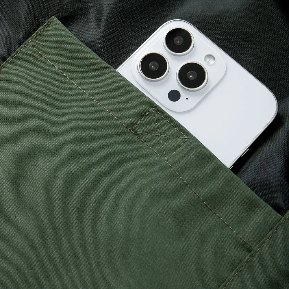 Men windproof hooded jacket olive green with durable fabric pocket holding smartphone on Tampa Home & Garden Store