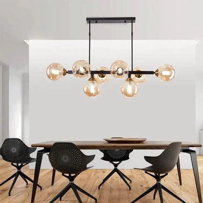 DecorBites LED pendant chandelier with eight amber glass globe bulbs on a black metal bar above a dining table on Tampa Home & Garden Store