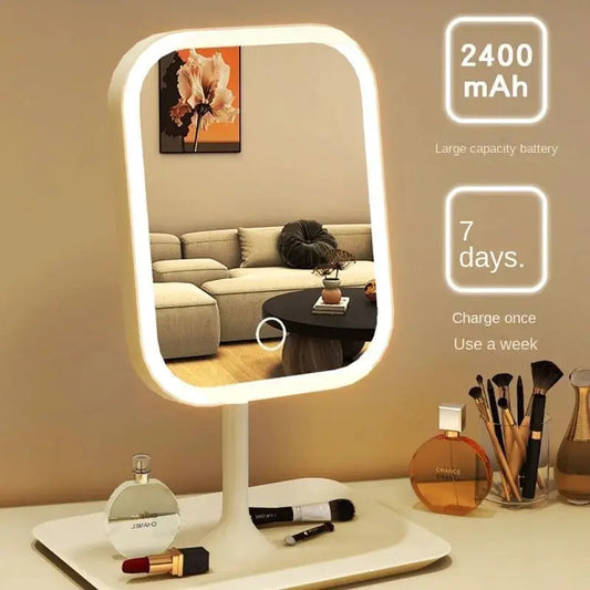 Moktan Sabai LED vanity mirror with 3 color lights, white frame on a stand beside makeup items on Tampa Home & Garden Store