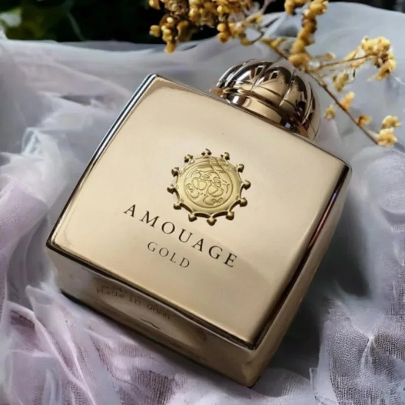 AMOUAGE Gold perfume bottle with crest emblem, ornate cap on Tampa Home & Garden Store