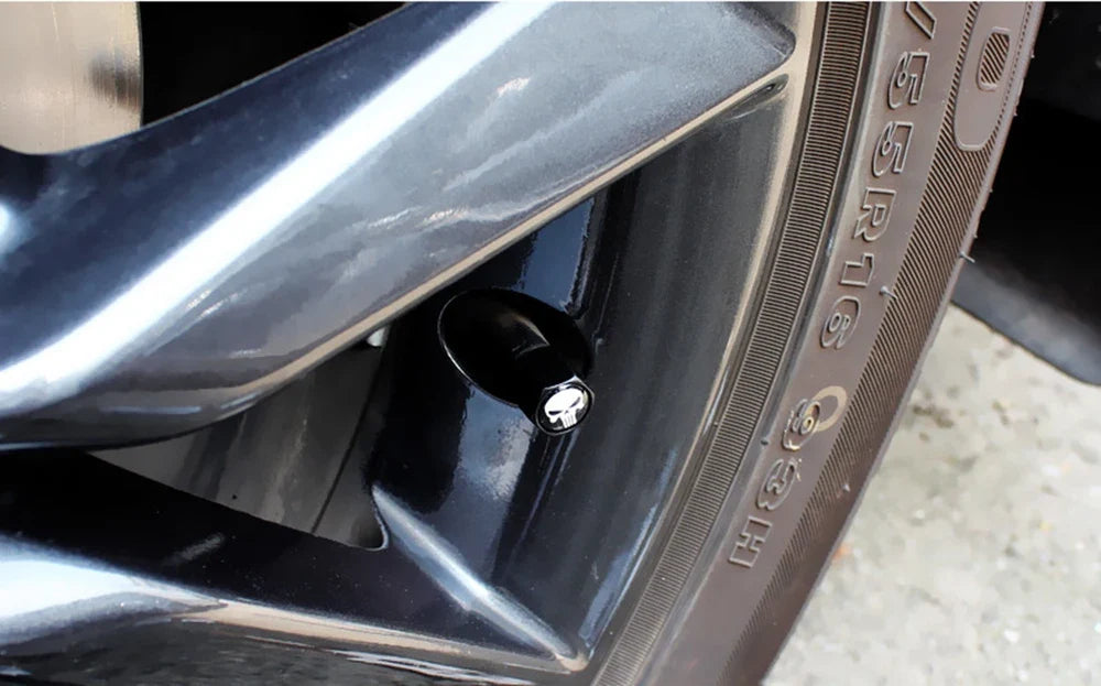 BikerZoneZ anti-theft skull valve stem cap on black wheel valve with silver skull emblem on Tampa Home & Garden Store