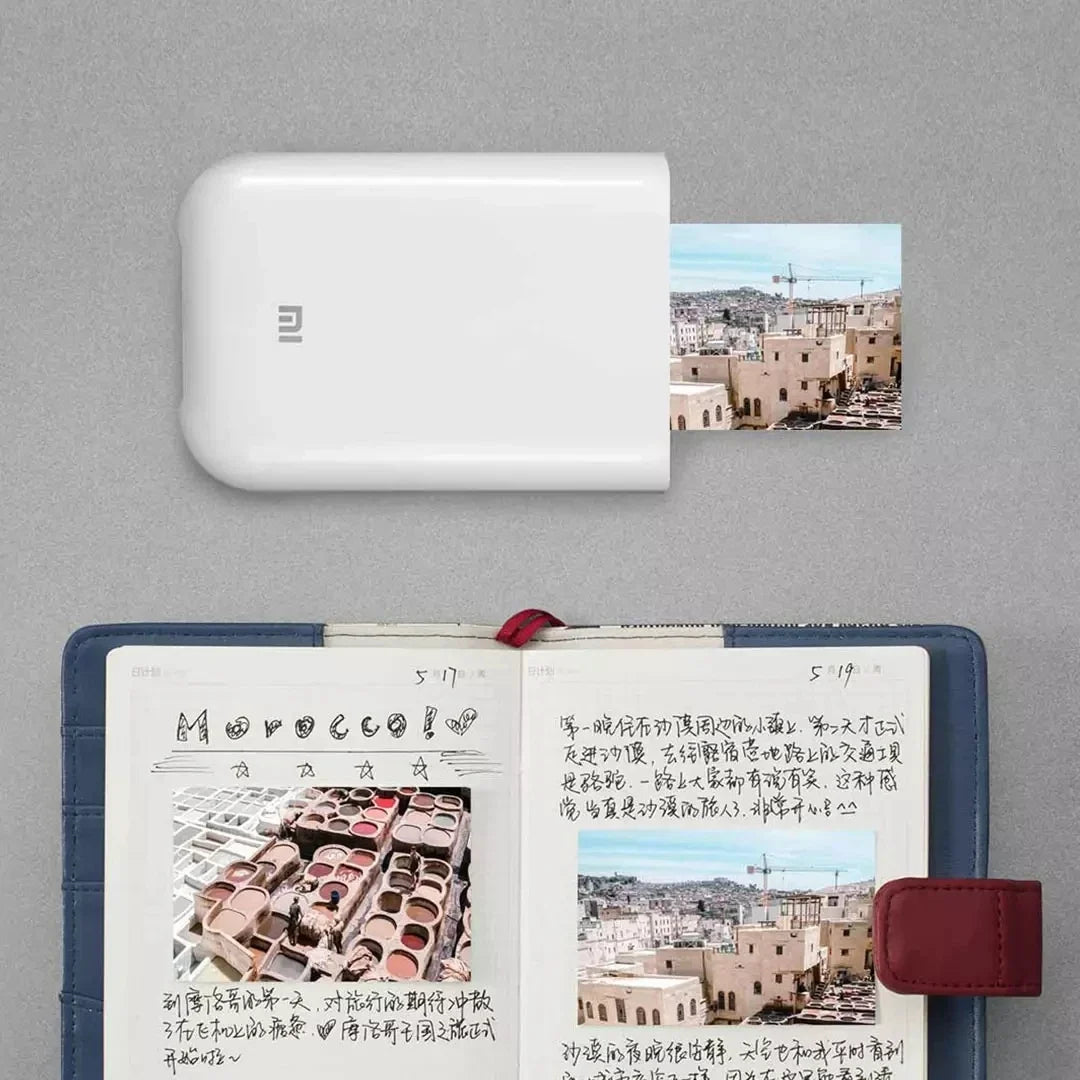 Portable Mini Photo Printer 300dpi by UpTrend Deals, white body device printing cityscape photo on Tampa Home & Garden Store