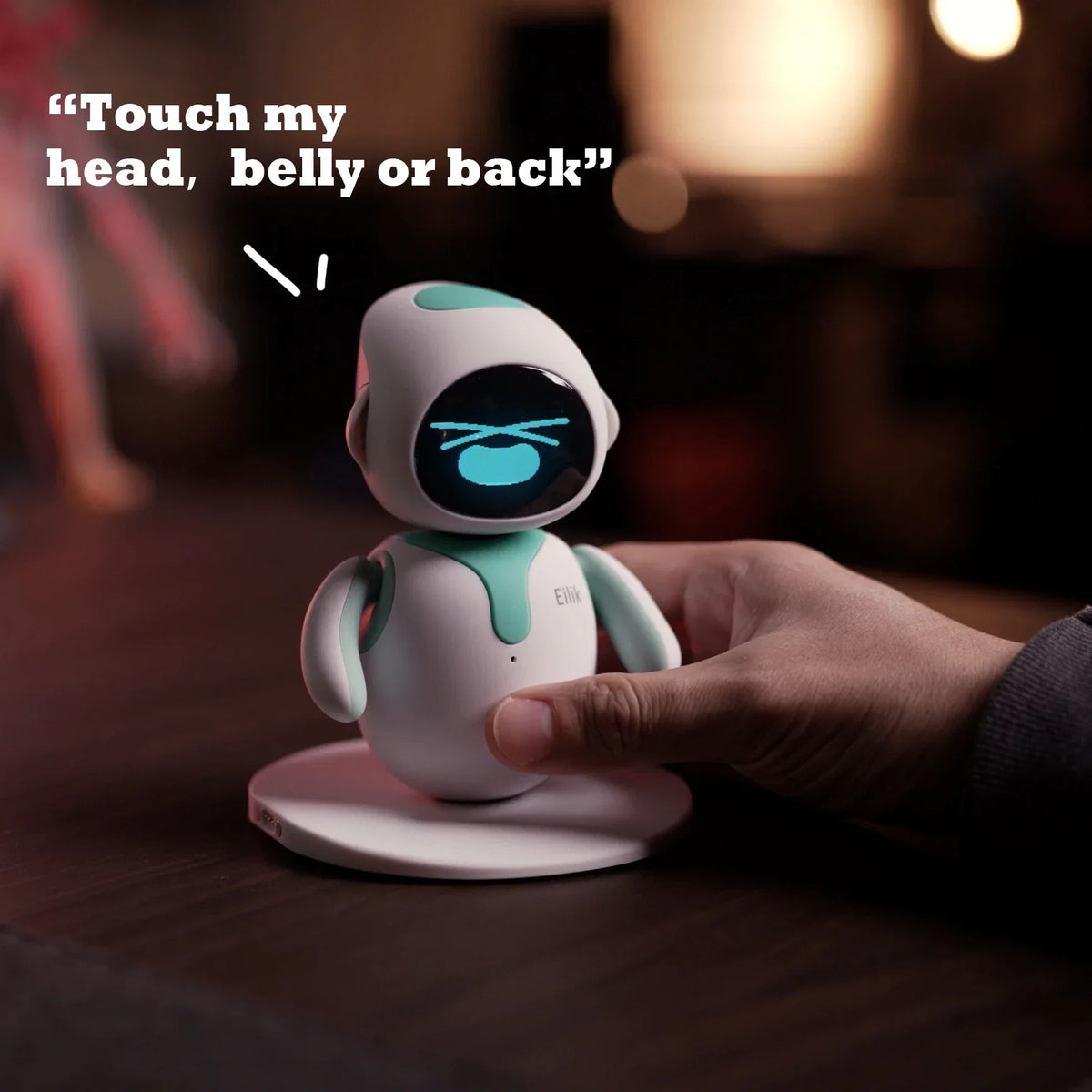 Eilik robot toy with white mint body, expressive face, held by hand as a desk companion on Tampa Home & Garden Store