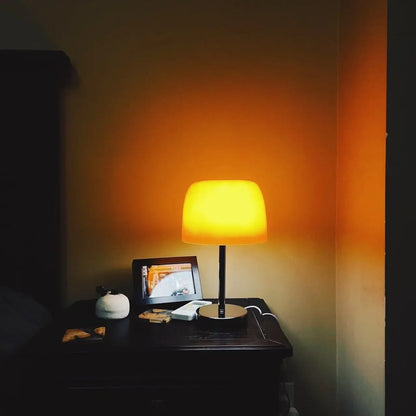 Perfecsy medieval glass table lamp with warm amber shade on a dark wood nightstand on Tampa Home & Garden Store