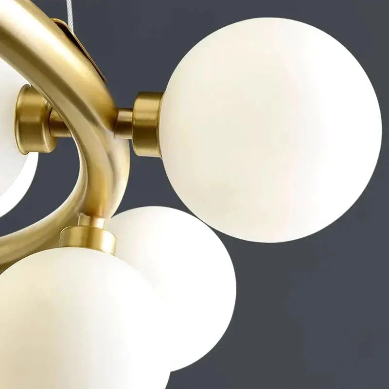 DecorBites LED pendant chandelier with brass frame and frosted globe bulbs on Tampa Home & Garden Store