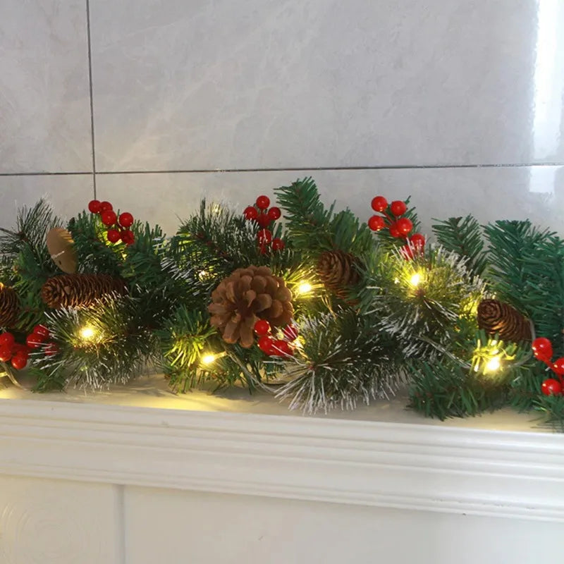 Perfecsy Christmas garland with pine branches, red berries, pinecones and warm lights on Tampa Home & Garden Store