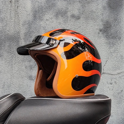 Retro motorcycle helmet by BikerZoneZ with orange and black flame graphics and clear visor on Tampa Home & Garden Store
