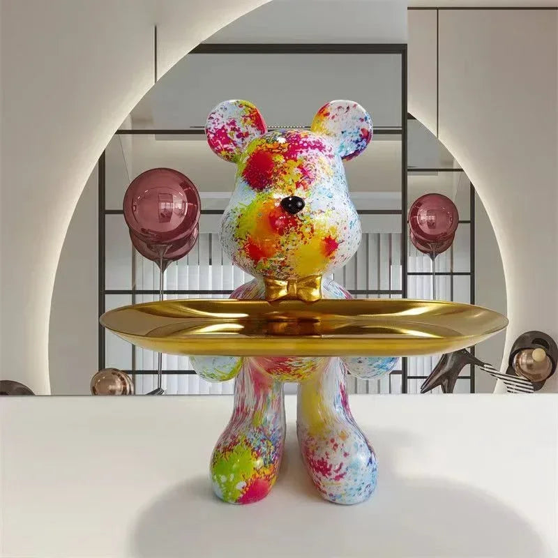 Graffiti bear ornament figurine with colorful paint splatters and gold tray decor piece on Tampa Home & Garden Store