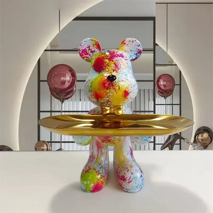 Graffiti bear ornament figurine with colorful paint splatters and gold tray decor piece on Tampa Home & Garden Store
