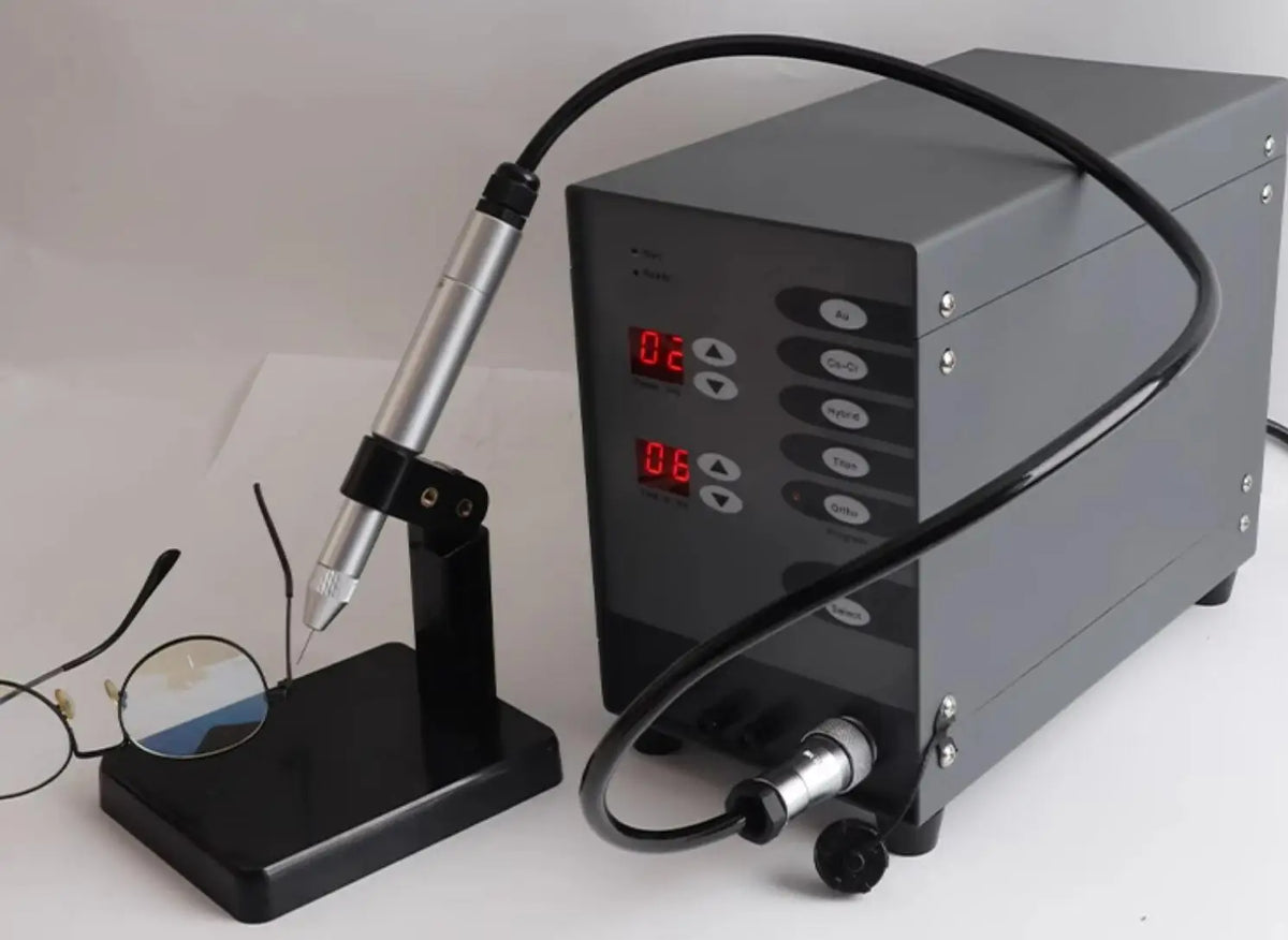 Stainless steel laser pulse spot welder with gray control unit and handheld torch on stand on Tampa Home & Garden Store