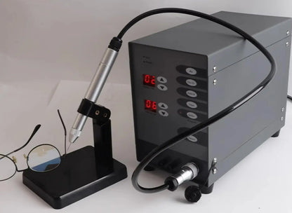 Stainless steel laser pulse spot welder with gray control unit and handheld torch on stand on Tampa Home & Garden Store