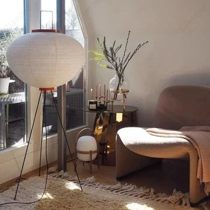 Perfecsy LED Rice Paper Floor Lamp with white shade on black tripod base in living room on Tampa Home & Garden Store