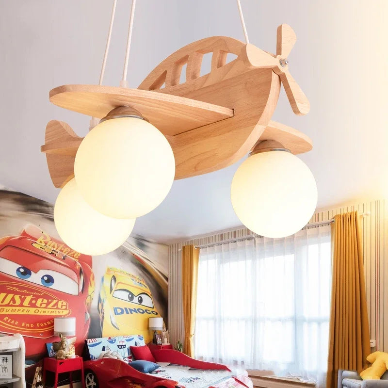 DecorBites Kids Wood Airplane Chandelier with two globe LED lights, natural wood finish on Tampa Home & Garden Store