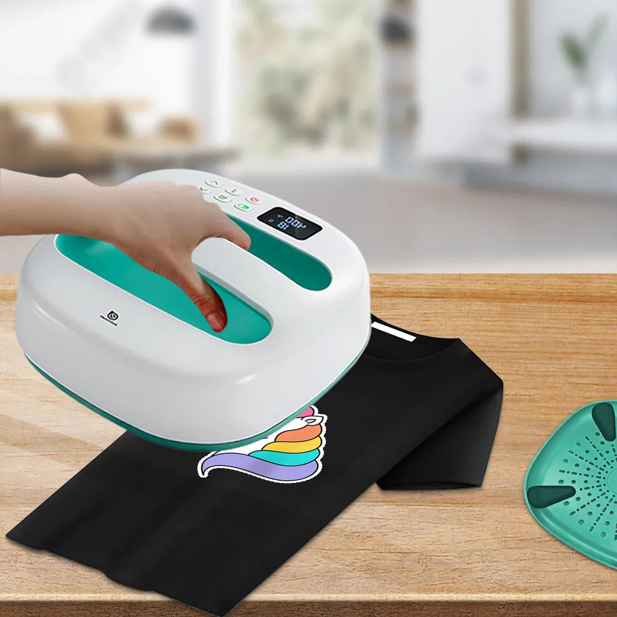 HP2 Heat Press Machine 9x9 portable press by UpTrend Deals pressing a black T-shirt with rainbow unicorn decal on Tampa Home & Garden Store