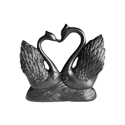 Heart-to-heart swan statue: black couple sculpture with detailed wings on a water base on Tampa Home & Garden Store