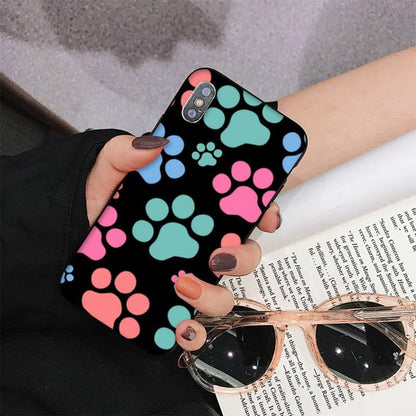 Dog paw print iPhone case by Stevvex with teal pink blue paw prints on black for iPhone models on Tampa Home & Garden Store