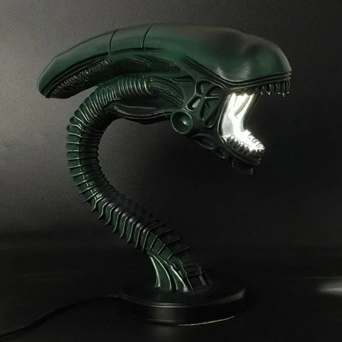 Alien resin figurine lamp stand by Perfecsy, green extraterrestrial head with ribbed neck on Tampa Home & Garden Store