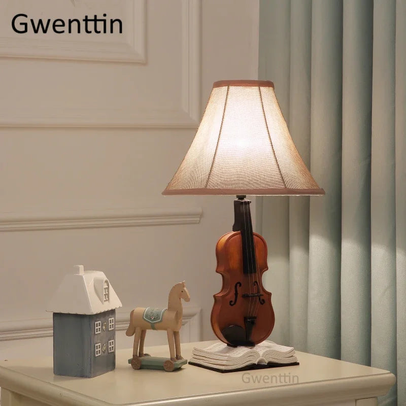 DecorBites Kids Violin LED Table Lamp with beige shade and wooden violin base on table on Tampa Home & Garden Store