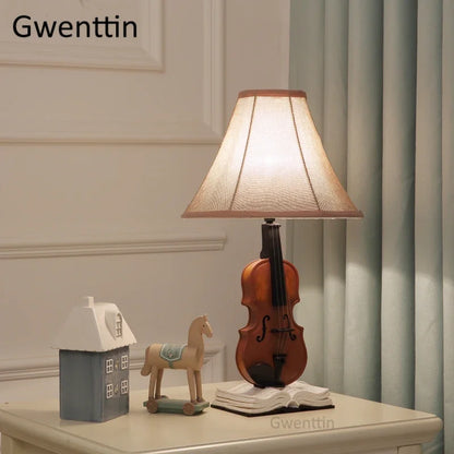 DecorBites Kids Violin LED Table Lamp with beige shade and wooden violin base on table on Tampa Home & Garden Store