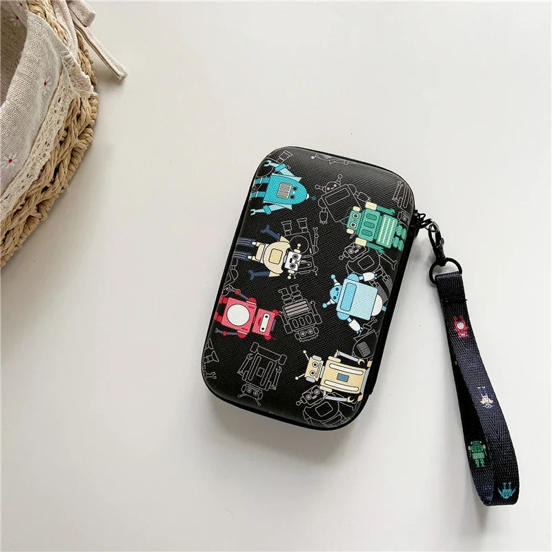 Black protective case for handheld game console with colorful robot print and wrist strap on Tampa Home & Garden Store
