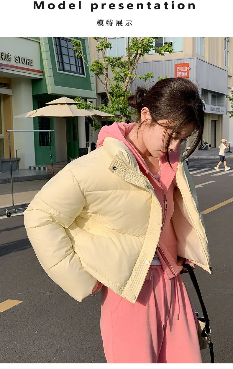 Women winter cropped cotton-padded puffer jacket in cream worn over pink sweatsuit on Tampa Home & Garden Store