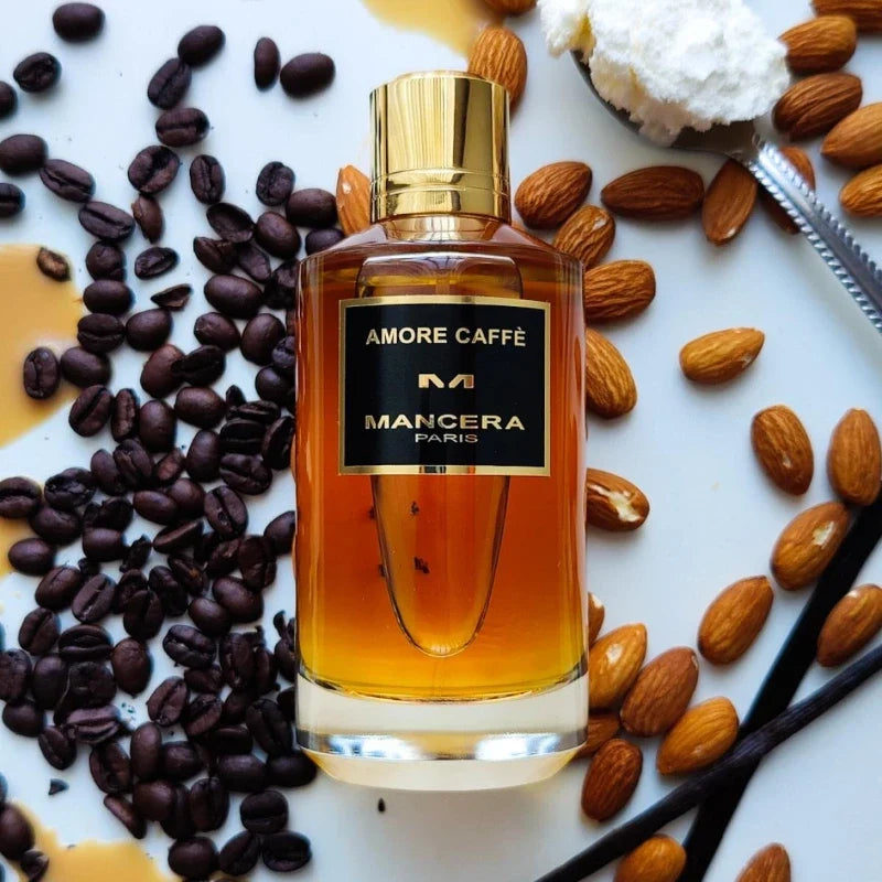 Mancera Amore Caffè perfume bottle with amber liquid and gold cap, set among coffee beans on Tampa Home & Garden Store