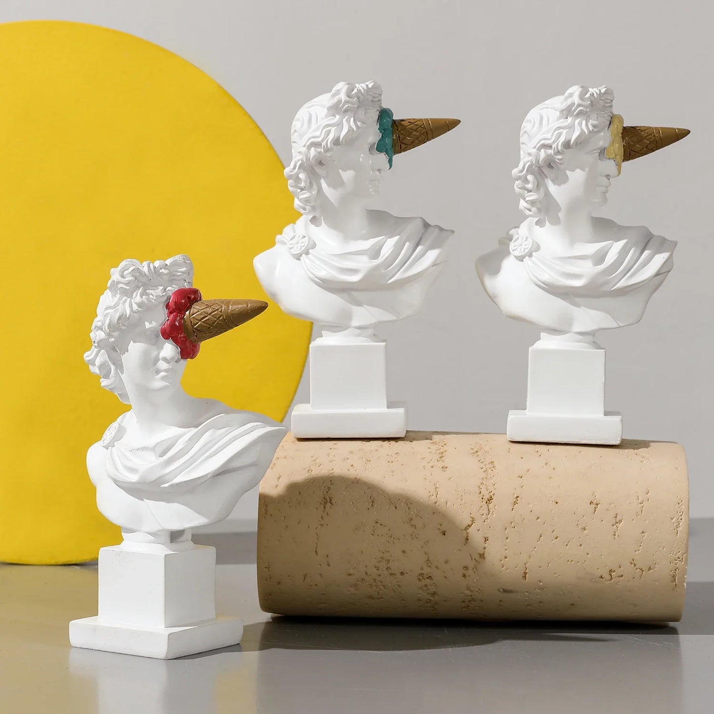 Apollo busts with ice cream cone hats, white resin statues on pedestals trio by Perfecsy on Tampa Home & Garden Store