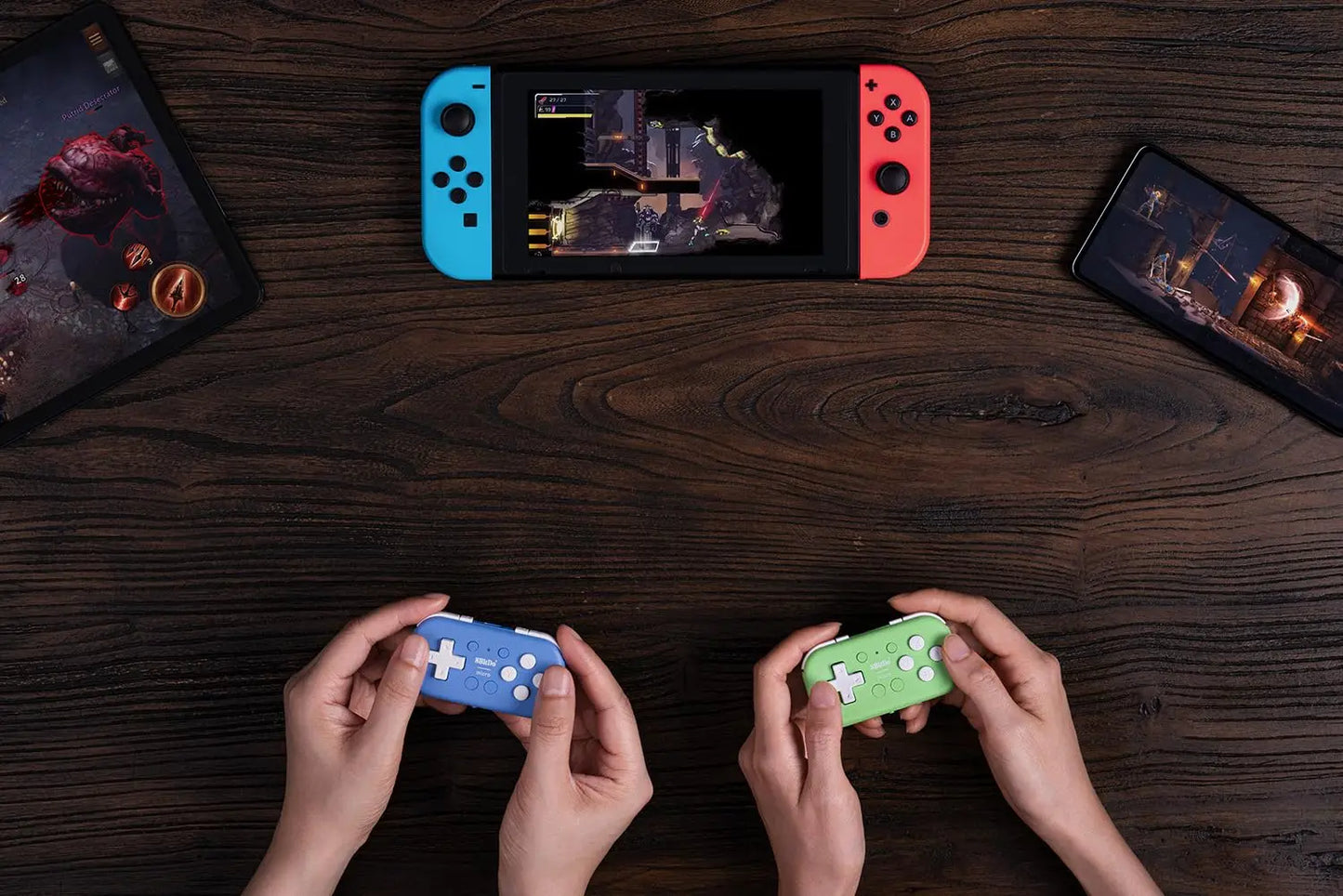 8Bitdo Micro Bluetooth Gamepad blue and green pocket-sized controllers held hands with Switch on Tampa Home & Garden Store