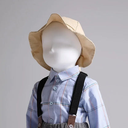 DecorBites Kids mannequin in light blue plaid shirt with suspenders and beige sun hat on Tampa Home & Garden Store