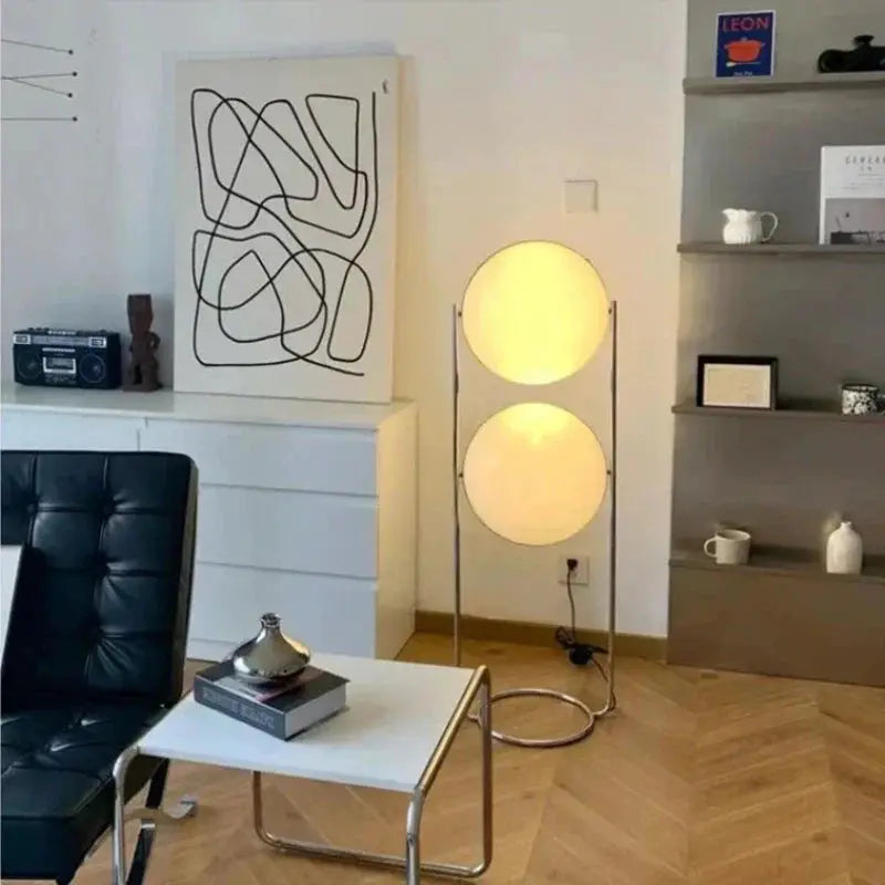 DecorBites LED Floor Lamp chrome metal frame with two white acrylic globes in living room on Tampa Home & Garden Store