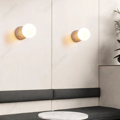 Retro LED Cream Wind Tunnel Stone Lamp pair wall sconces with globes above gray sofa on Tampa Home & Garden Store