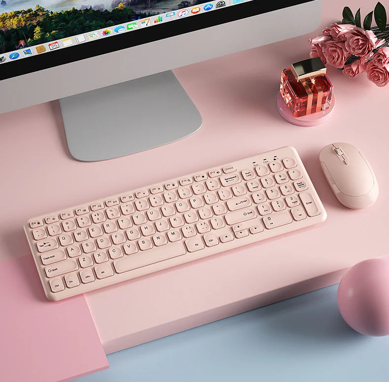 Purple wireless keyboard and mouse set by FLIPSTYLEZLLC on a pink desk beside an iMac on Tampa Home & Garden Store